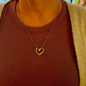 14 karat solid gold heart pendant. This pendant has a 3-D quality to it. Unique.